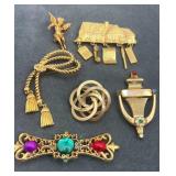 Collection of gold tone pins
