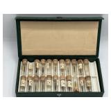 Watch hands assortment in green case