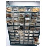 Assorted watch parts in storage case