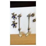 Silvertone pierced earrings, some need