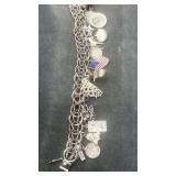 S.S. Charm Bracelet s/ mostly silver charms. 60g