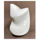 This is a small abstract carved stone sculpture,