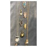 Collection of owl necklaces, pins & pendants