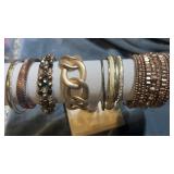 Brown and gold tone bracelets