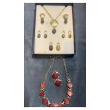 Necklace & clip on earring sets.  One set has