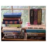 Variety of Books Clancy Cussler Military Brokaw