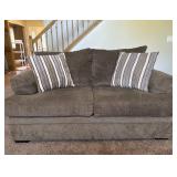 Brown Upholstered Loveseat With Pillows