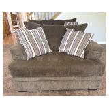 Brown Upholstered Big Chair And Pillows