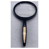dual-lens handheld reading magnifying glass.