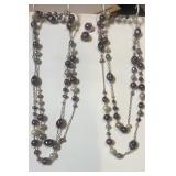 2 long beaded necklaces & clip on earrings.  48'