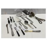 Collection of serving utensils and cheese spread