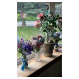 4 Faux flowers in vases.