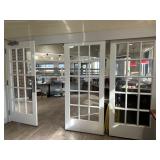 Four fifteen pane panel doors  - 3 on slide track,