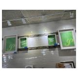 Four white shadowbox frames