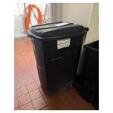 Black rolling trash can