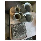 Five metal measuring cups & 4 racks