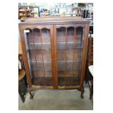 Tiger oak claw footed glass display cabinet with