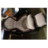 Pink tufted parlor chair with rose carved crown