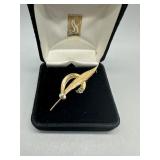18kt Yellow and White gold Broach symbolizing a fe