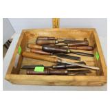 Masonry Tray with a large assortment of chisels in
