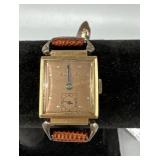 Ladies Bulova Watch with red band with pink face