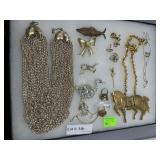 Assorted costume jewelry lot incl figural brooches