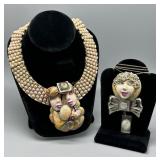 Artist signed Abstract costume face necklace and c