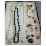 Costume jewelry grouping in peach and green hues i