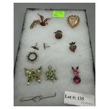 Nine brooches incl screw back earrings that comple