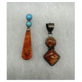 Two sterling orange stone pendants - 15.0 gtw - on