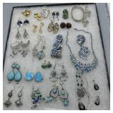 Costume jewelry loaded with earrings, bracelets,