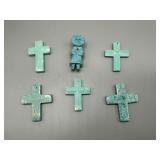 Five turquoise crosses and one turquoise Eskimo pe