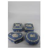 Four Wedgwood lidded boxes in blue and white