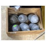 Six Red Comet fire extinguishers in wood crate