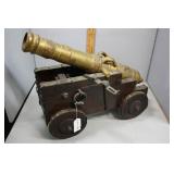 Decorative brass cannon on wooden carriage