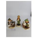 Three Hummel figures: Boy with goose, boy with mus
