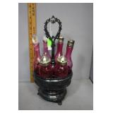 Castor set with six cranberry bottles and rotating