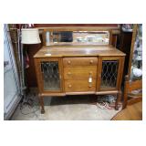 Oak sideboard with beveled mirror back, three draw