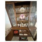 China cabinet contents - candles, linens, clear gl