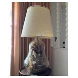 Glass table lamp with floral preserved dï¿½cor