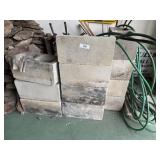 10 full and one half concrete blocks and green