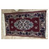 Machine knotted throw rug