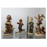 Four Goebel figurines incl skiing boy, girl feedin