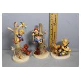 Three Goebel figurines incl girl in tree with dog,