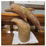 Wood carved dolphin on stand