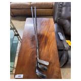 Three antique wood handle golf clubs - two