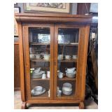 Oak double door four shelf display cabinet