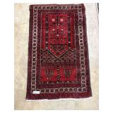 Hand knotted throw rug 43" x 26" in red tones