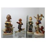 Four Goebel figurines incl skiing boy, girl feedin