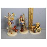 Three Goebel figurines incl girl in tree with dog,